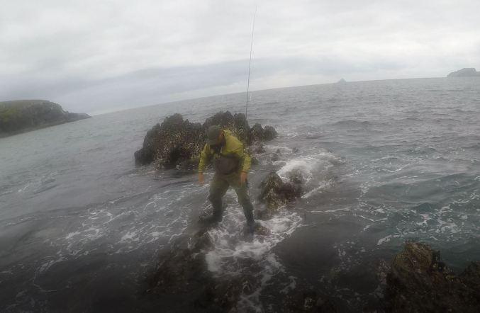 Andy staggering on rocks